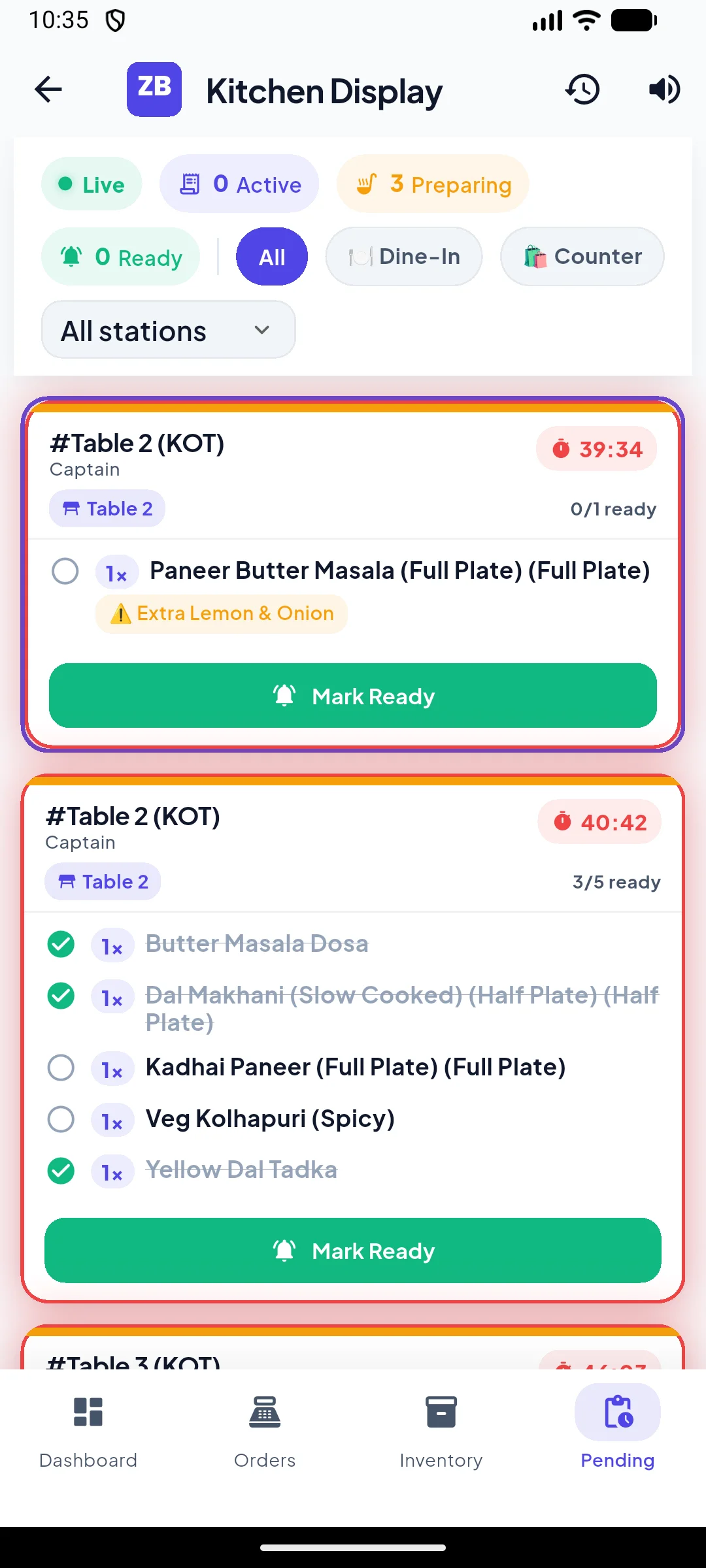 Kitchen Display screen on phone showing live KOT orders with elapsed timers and item lists.